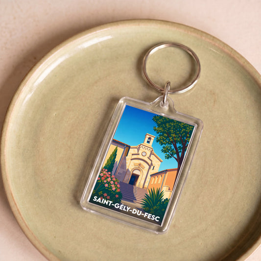 Porte-clés souvenir de la ville de Saint-Gély-du-Fesc avec une illustration stylisée de son église.