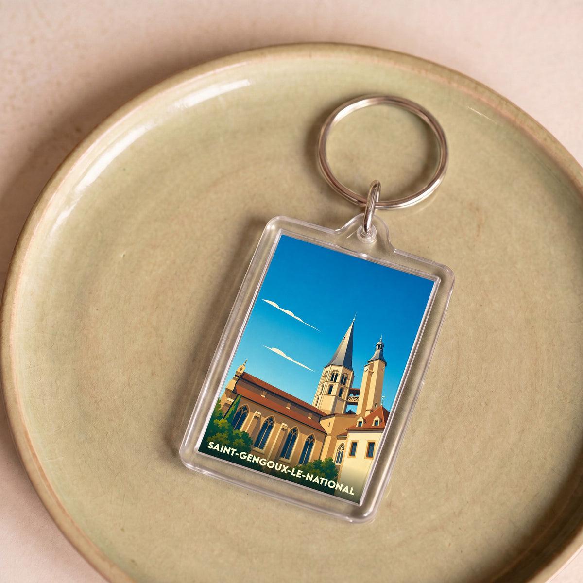 Porte-clés souvenir de la ville de Saint-Gengoux-le-National avec une illustration stylisée de son église médiévale.