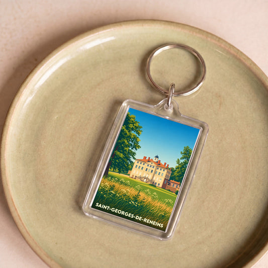 Porte-clés souvenir de la ville de Saint-Georges-de-Reneins avec une illustration stylisée d'un château.