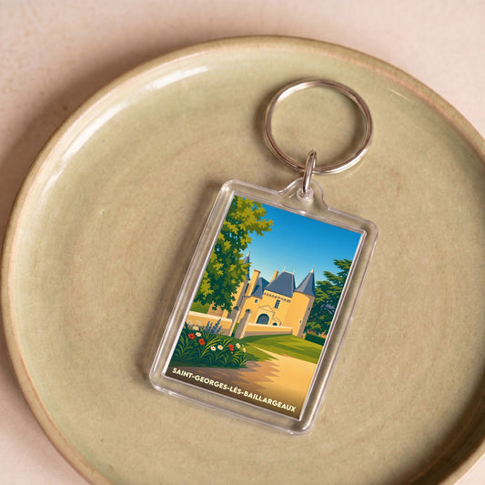 Porte-clés souvenir de la ville de Saint-Georges-lès-Baillargeaux avec une illustration stylisée d'un château.