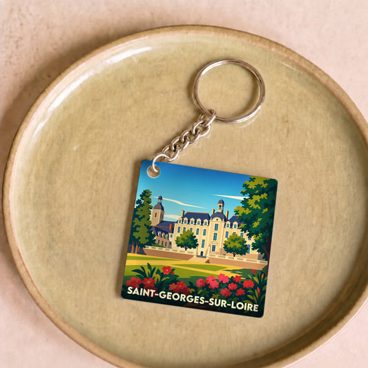 Porte-clés souvenir de la ville de Saint-Georges-sur-Loire avec une illustration stylisée d'un château.