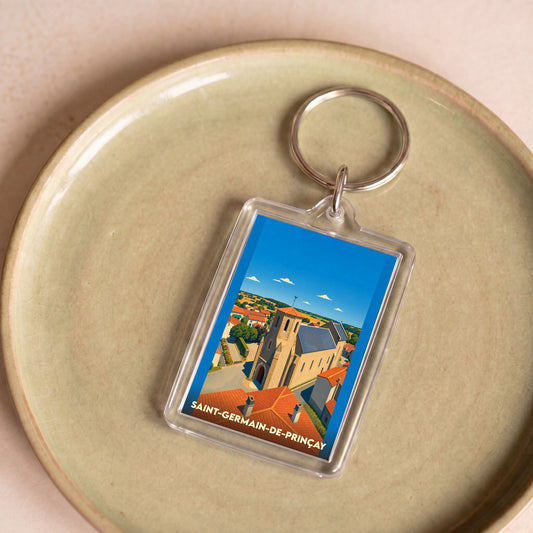 Porte-clés souvenir de la ville de Saint-Germain-de-Prinçay avec une illustration stylisée de son église.