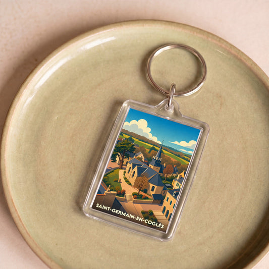 Porte-clés souvenir de Saint-Germain-en-Coglès avec une illustration stylisée du village.