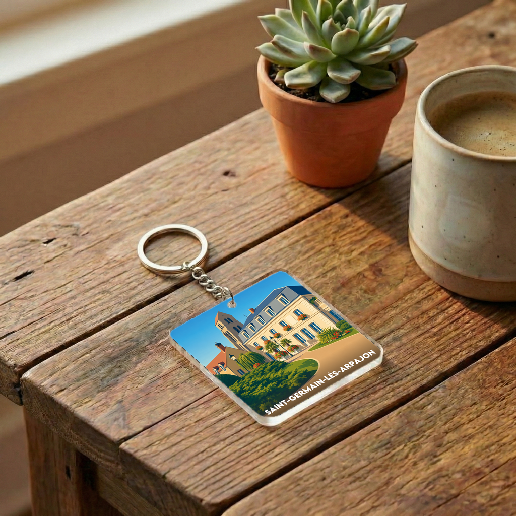 Porte-clés souvenir de la ville de Saint-Germain-lès-Arpajon avec une illustration stylisée.