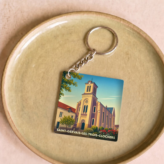 Porte-clés souvenir de la ville de Saint-Gervais-les-Trois-Clochers avec une illustration stylisée de son église.