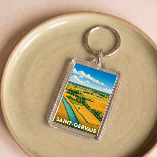 Porte-clés souvenir de la ville de Saint-Gervais avec une illustration stylisée d'un paysage rural.