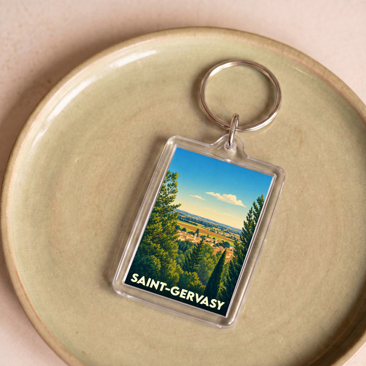 Porte-clés souvenir de la ville de Saint-Gervasy avec une illustration de paysage stylisée.