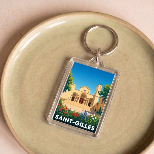 Porte-clés souvenir de la ville de Saint-Gilles avec une illustration stylisée.