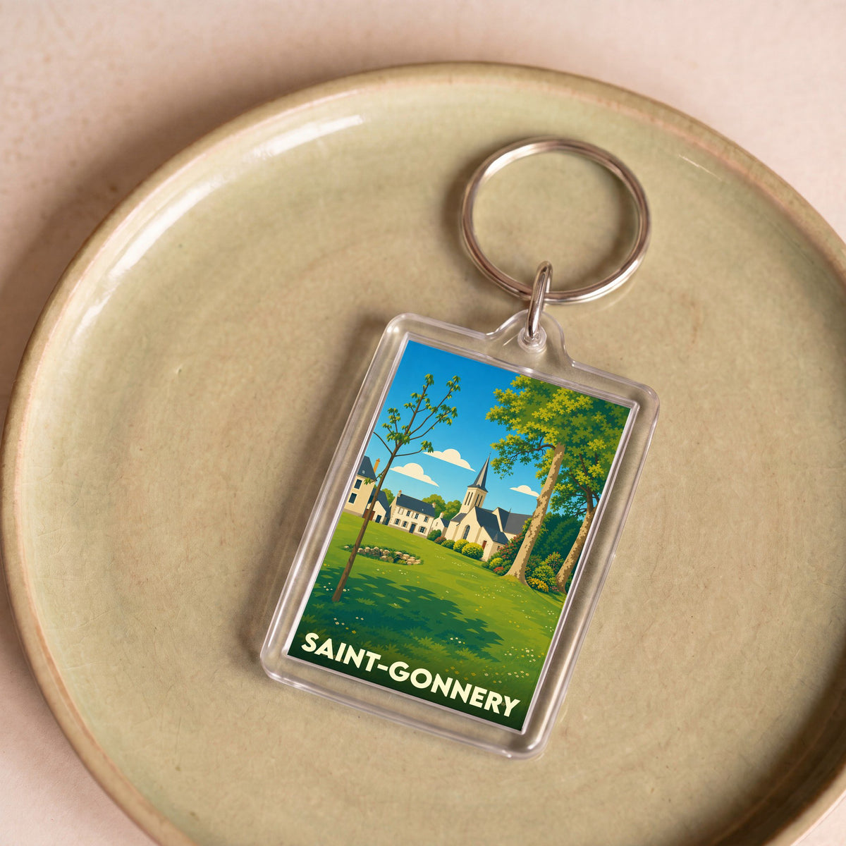 Porte-clés souvenir de la ville de Saint-Gonnery avec une illustration stylisée.