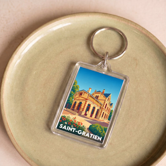 Porte-clés souvenir de la ville de Saint-Gratien avec une illustration stylisée.