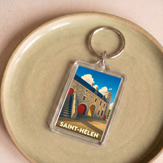 Porte-clés souvenir de la ville de Saint-Hélen avec une illustration stylisée de son patrimoine en pierre.