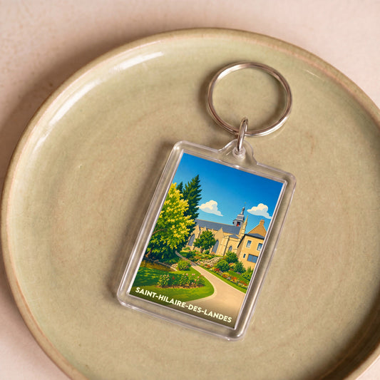Porte-clés souvenir de la ville de Saint-Hilaire-des-Landes avec une illustration stylisée.
