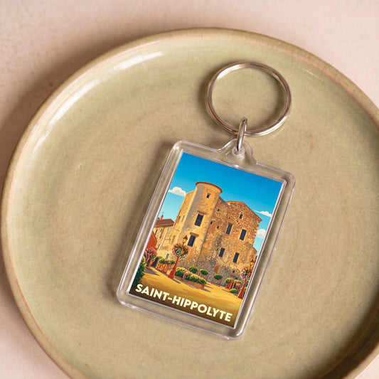 Porte-clés souvenir de la ville de Saint-Hippolyte avec une illustration stylisée.