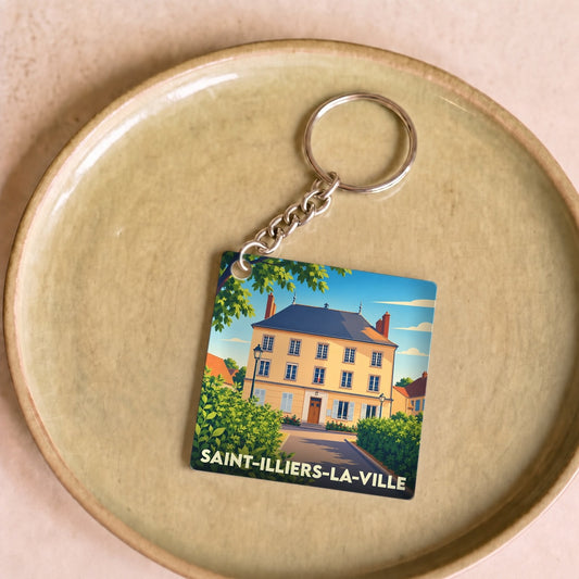 Porte-clés souvenir de la commune de Saint-Illiers-la-Ville avec une illustration stylisée de sa mairie.