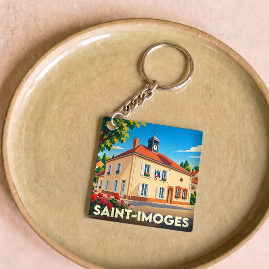 Porte-clés souvenir de la ville de Saint-Imoges avec une illustration stylisée de sa mairie.