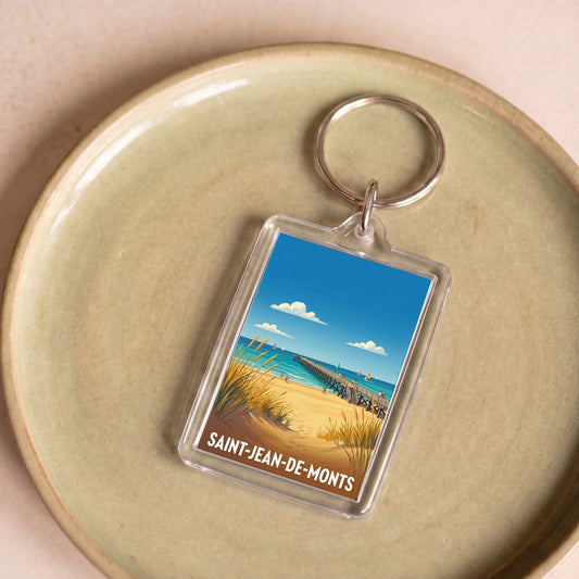 Porte-clés souvenir de la ville de Saint-Jean-de-Monts avec une illustration stylisée de son bord de mer.