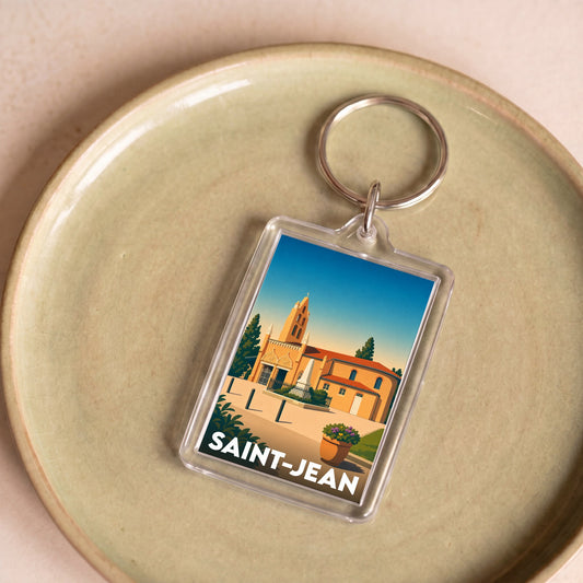 Porte-clés souvenir de la ville de Saint-Jean avec une illustration stylisée.