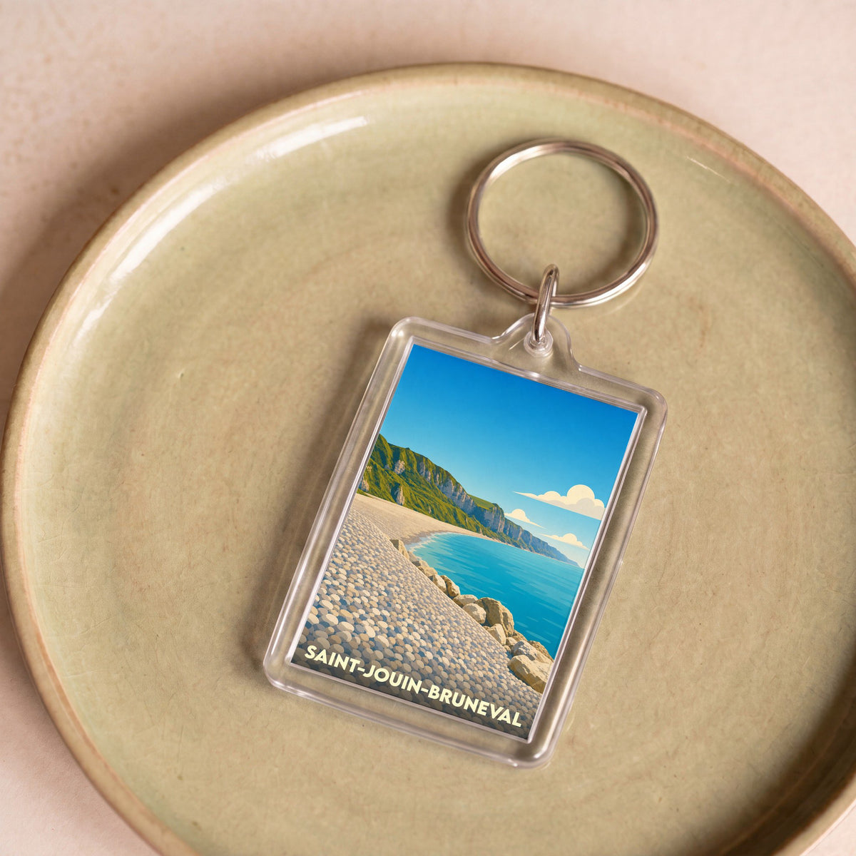 Porte-clés souvenir de la ville de Saint-Jouin-Bruneval avec une illustration stylisée de sa plage et de ses falaises.