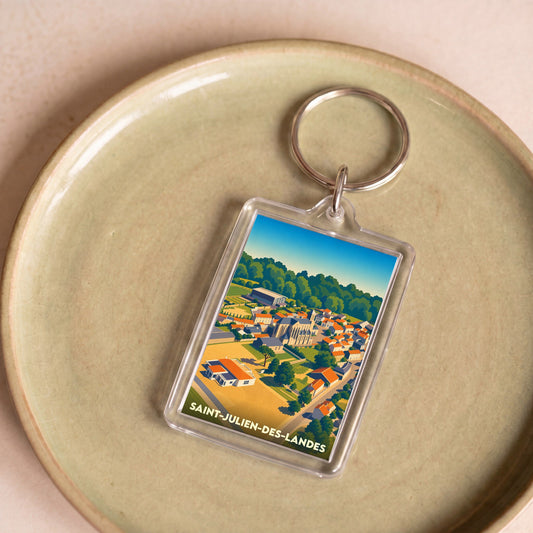 Porte-clés souvenir de la ville de Saint-Julien-des-Landes avec une illustration stylisée.