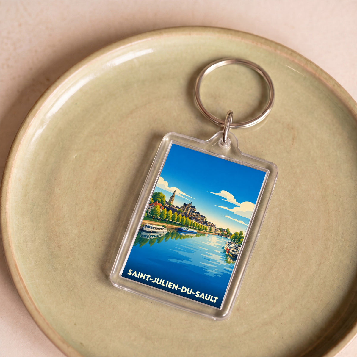 Porte-clés souvenir de la ville de Saint-Julien-du-Sault avec une illustration stylisée.