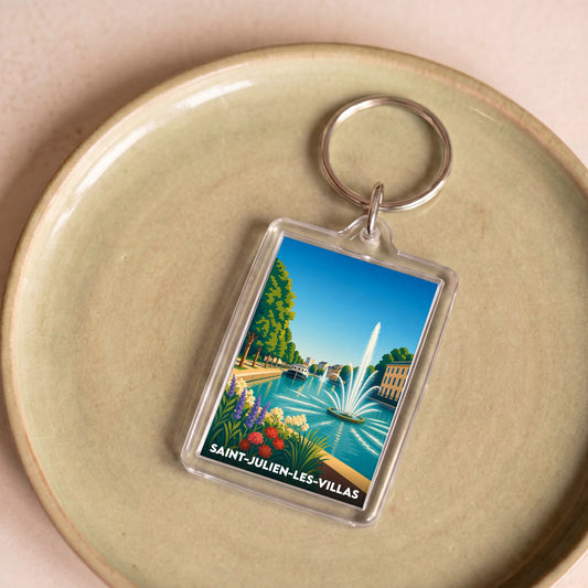 Porte-clés souvenir de la ville de Saint-Julien-les-Villas avec une illustration stylisée.