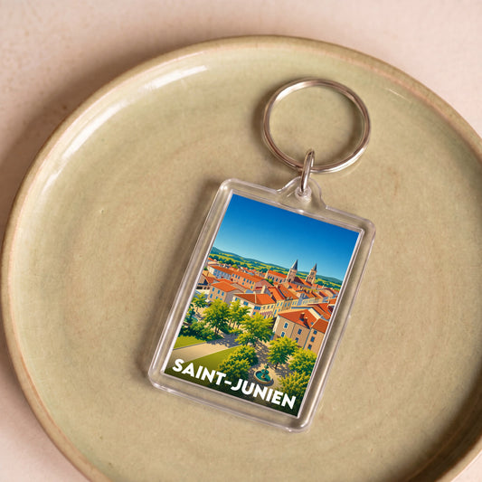 Porte-clés souvenir de la ville de Saint-Junien avec une illustration stylisée.