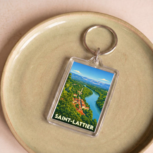 Porte-clés souvenir de la ville de Saint-Lattier avec une illustration stylisée d'un paysage de rivière et de montagnes.
