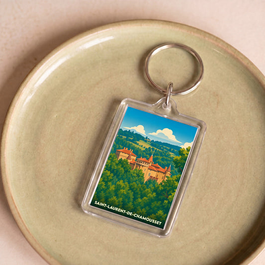 Porte-clés souvenir de la ville de Saint-Laurent-de-Chamousset avec une illustration stylisée de son château.
