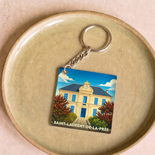 Porte-clés souvenir de la ville de Saint-Laurent-de-la-Prée avec une illustration stylisée.