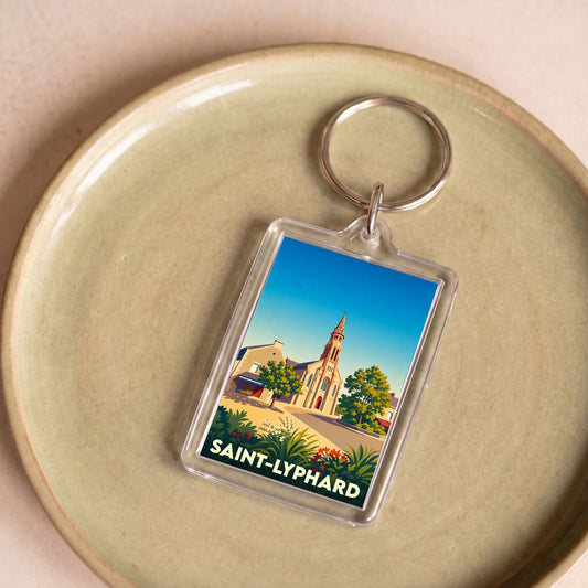 Porte-clés souvenir de la ville de Saint-Lyphard avec une illustration stylisée de son église.