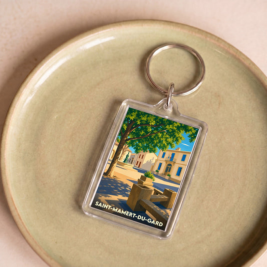 Porte-clés souvenir de la ville de Saint-Mamert-du-Gard avec une illustration stylisée.