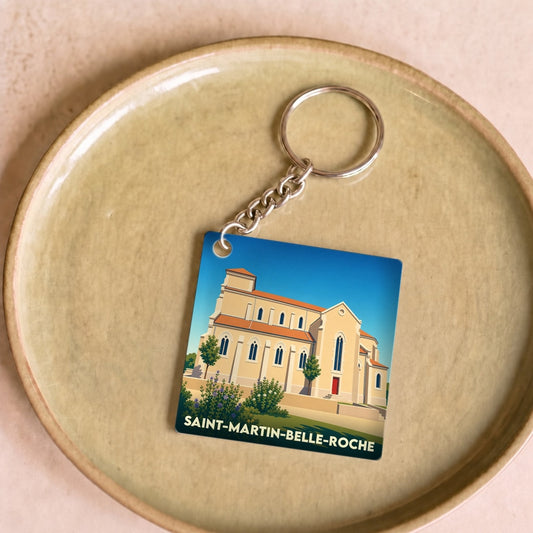 Porte-clés souvenir de la ville de Saint-Martin-Belle-Roche avec une illustration stylisée de son église.