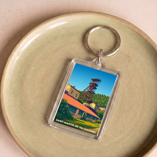Porte-clés souvenir de la ville de Saint-Martin-de-Valgalgues avec une illustration stylisée d'un ancien puits de mine.
