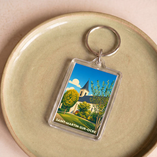 Porte-clés souvenir de la ville de Saint-Martin-sur-Ocre avec une illustration stylisée de son église.