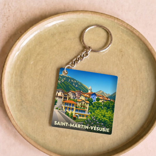 Porte-clés souvenir de la ville de Saint-Martin-Vésubie avec une illustration stylisée.