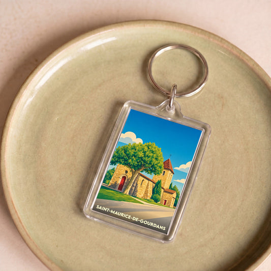 Porte-clés souvenir de la ville de Saint-Maurice-de-Gourdans avec une illustration stylisée de son église.