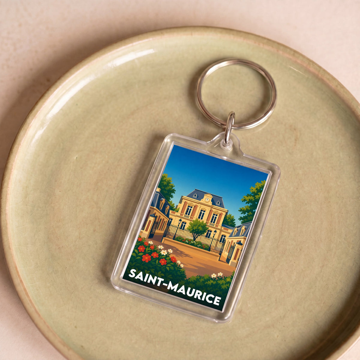 Porte-clés souvenir de la ville de Saint-Maurice avec une illustration stylisée.