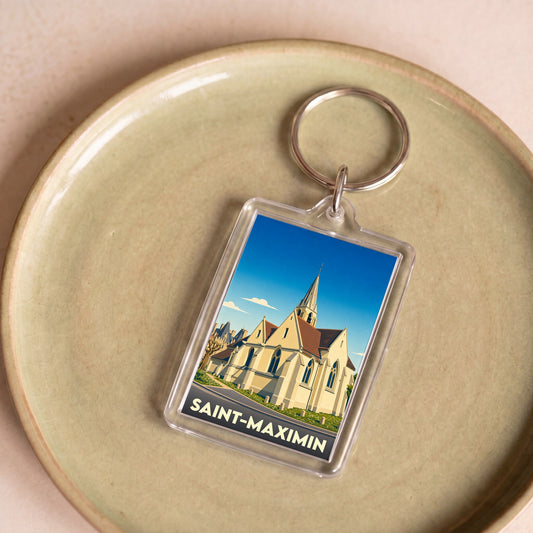 Porte-clés souvenir de la ville de Saint-Maximin avec une illustration stylisée de son église.