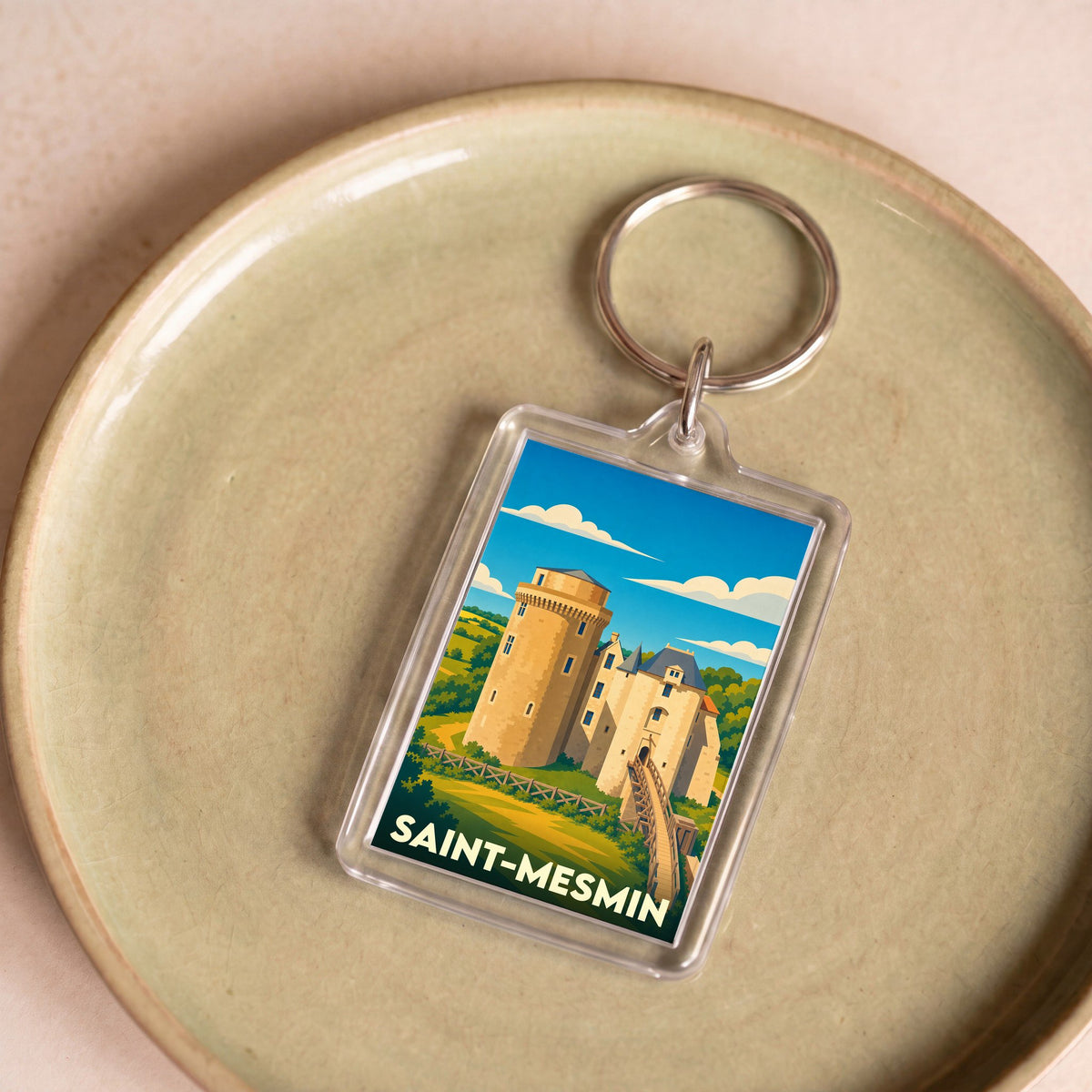 Porte-clés souvenir de la ville de Saint-Mesmin avec une illustration stylisée de son château.