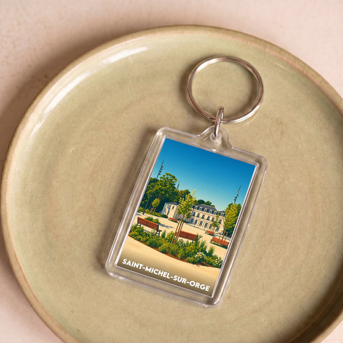 Porte-clés souvenir de la ville de Saint-Michel-sur-Orge avec une illustration stylisée d'un parc.