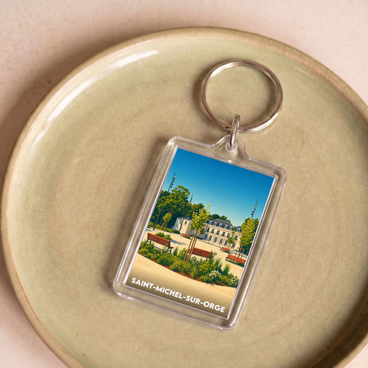 Porte-clés souvenir de la ville de Saint-Michel-sur-Orge avec une illustration stylisée d'un parc.