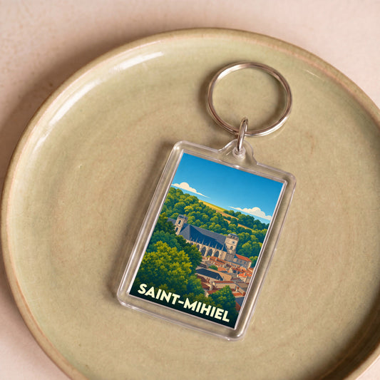 Porte-clés souvenir de la ville de Saint-Mihiel avec une illustration stylisée.