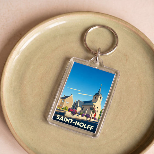 Porte-clés souvenir de la ville de Saint-Nolff avec une illustration stylisée de son église.