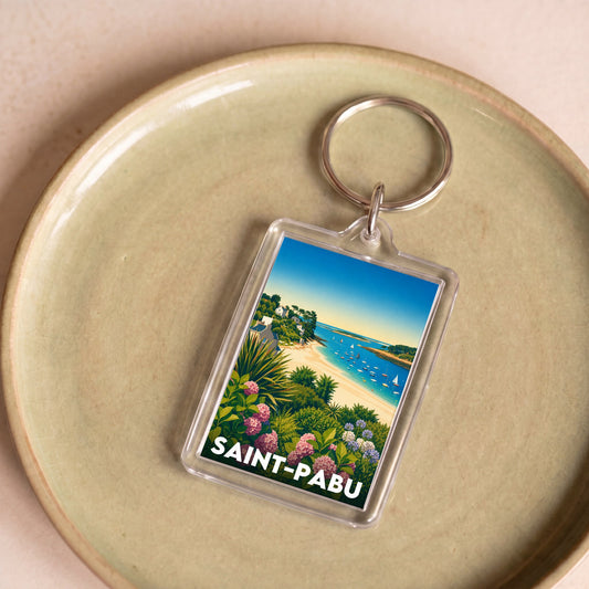 Porte-clés souvenir de la ville de Saint-Pabu avec une illustration stylisée.