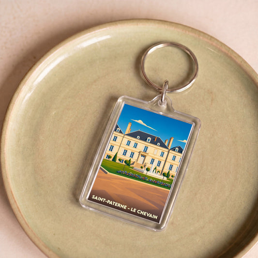 Porte-clés souvenir de la ville de Saint-Paterne avec une illustration stylisée de château.
