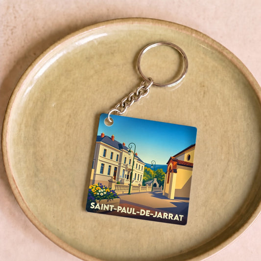Porte-clés souvenir de la ville de Saint-Paul-de-Jarrat avec une illustration stylisée.