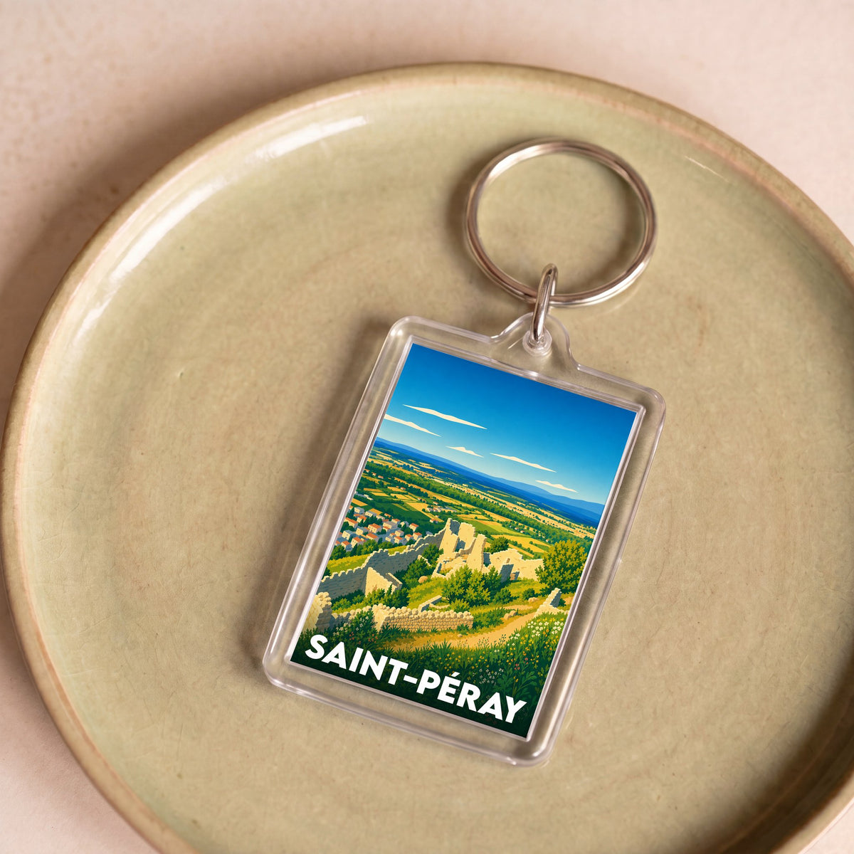 Porte-clés souvenir de la ville de Saint-Péray avec une illustration stylisée des ruines du château de Crussol.