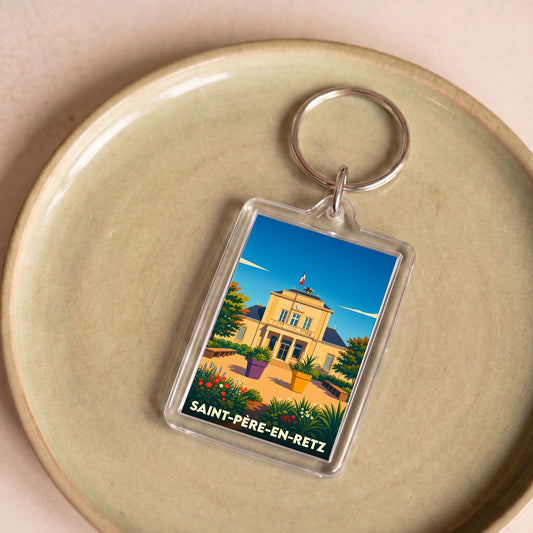 Porte-clés souvenir de la ville de Saint-Père-en-Retz avec une illustration stylisée de la mairie.