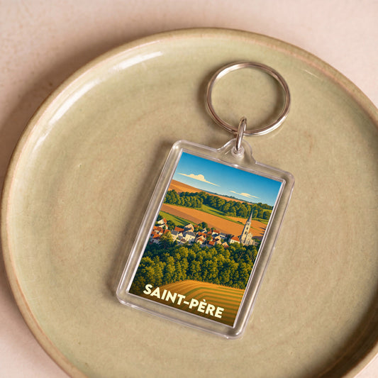 Porte-clés souvenir de la ville de Saint-Père avec une illustration stylisée d'un paysage rural.