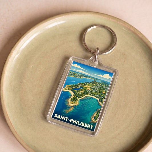 Porte-clés souvenir de la ville de Saint-Philibert avec une illustration stylisée d'un paysage côtier vu du ciel.